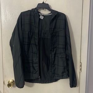 Nike windbreaker. Great for runners. Size M in Womens. Black/grey.